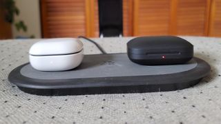 Samsung Galaxy Buds 2 and OnePlus Buds Pro on charging pad