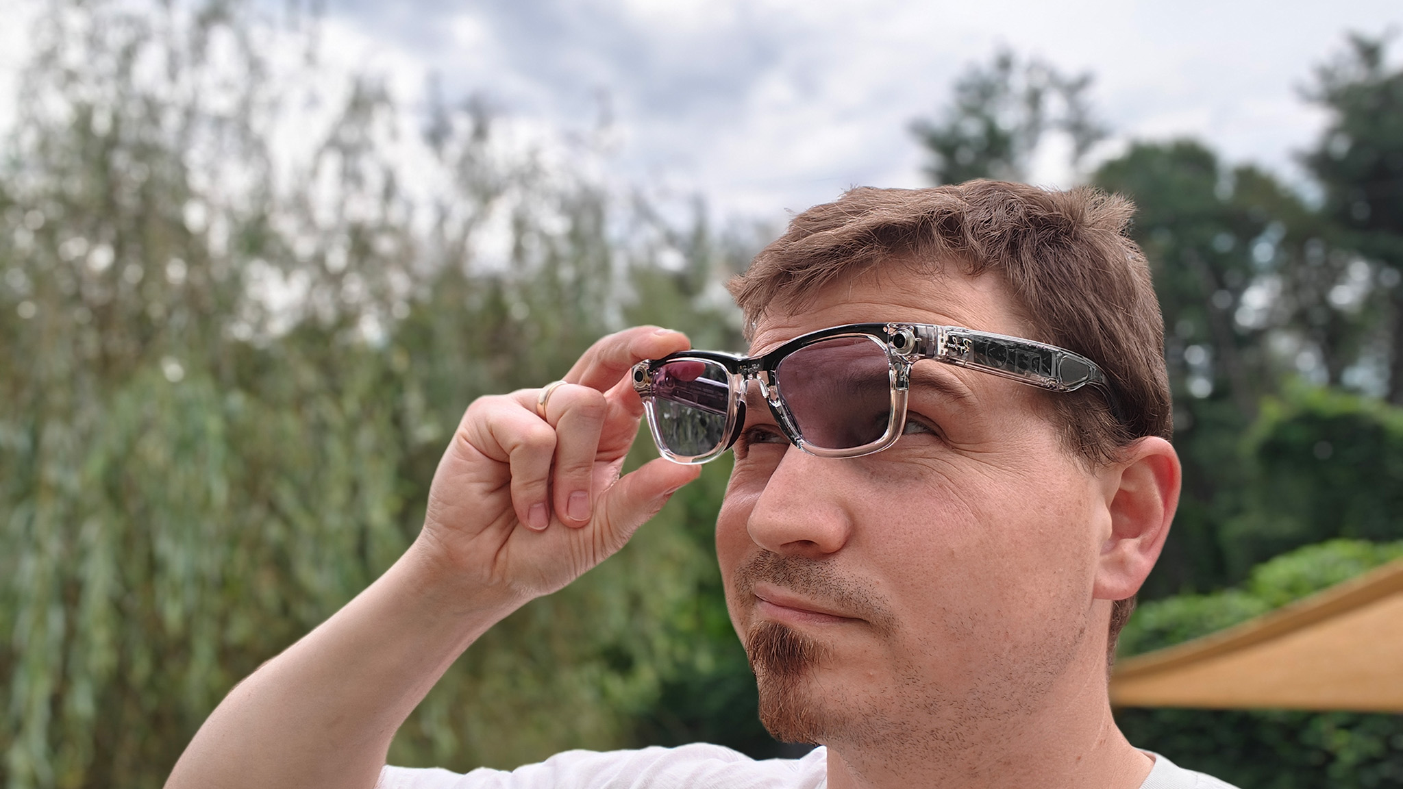 Inspecting the inside of transparent Ray-Ban Meta Smart Glasses with transitions lenses before putting them on
