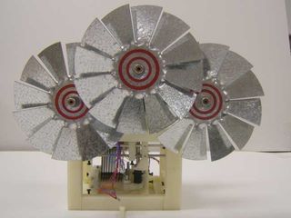 Miniature windmills such as this one could help power devices where sunlight is not available.