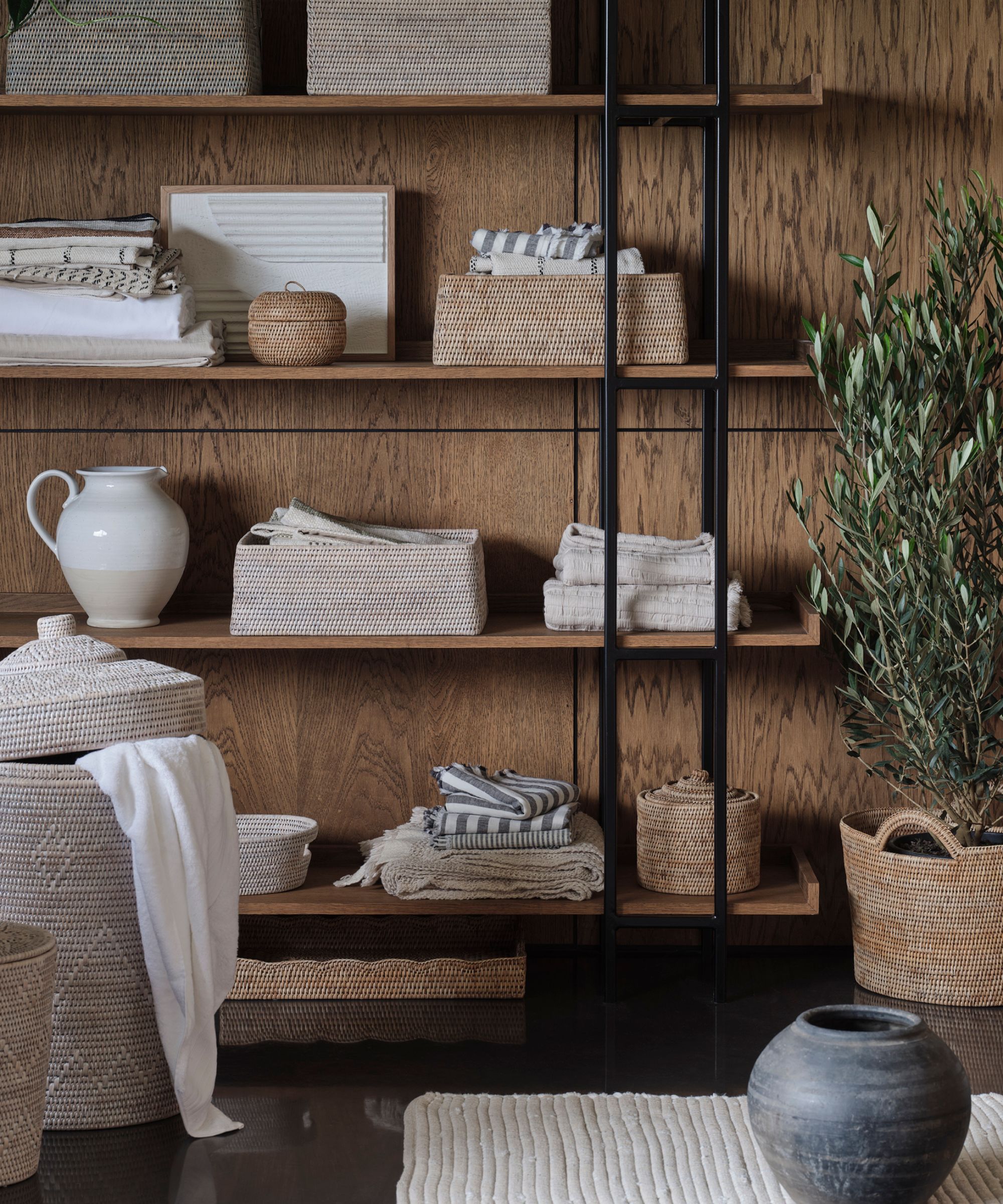 Wooden wall, wooden shelves, storage baskets, vase