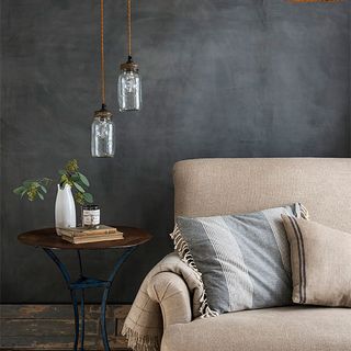 living room with grey wall and sofaset with cushions