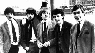 Rolling Stones posing for a photograph on the banks of the River Thames in the early 1960s