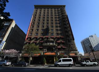 an image of the outside of the Cecil Hotel, which at this time was rebranded as Stay on Main