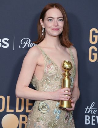 Emma Stone holds Golden Globe award