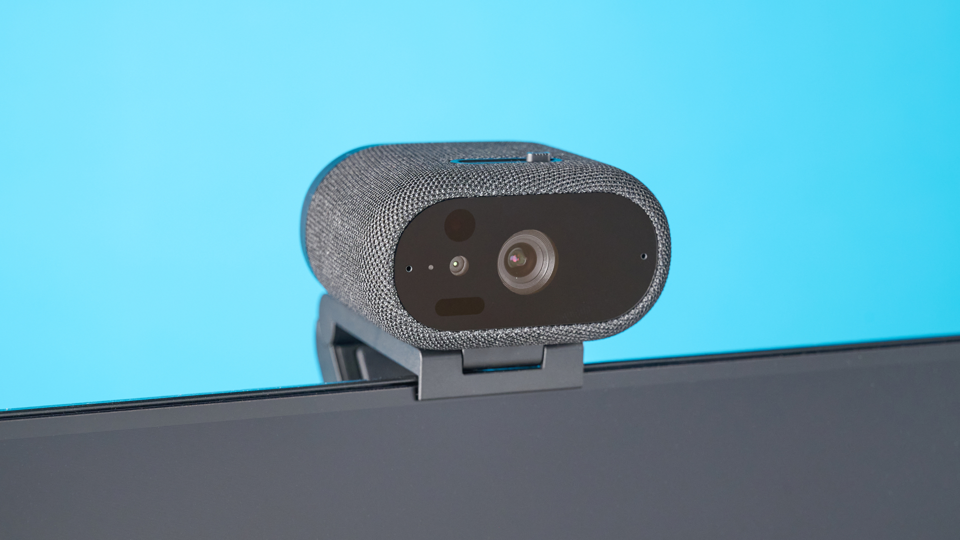 Dell Pro 7 Webcam photographed in front of a blue background