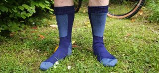 Man front on wearing the Sealskinz Runton socks