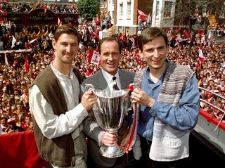 George Graham, centre, parades the UEFA Cup Winners' Cup with Arsenal captain Tony Adams, left, and Alan Smith