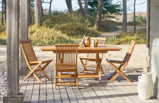 A wooden outdoor dining table and chairs