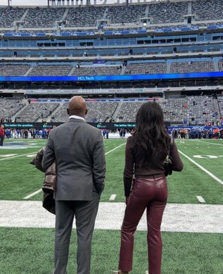 Woman wearing a football stadium outfit idea.