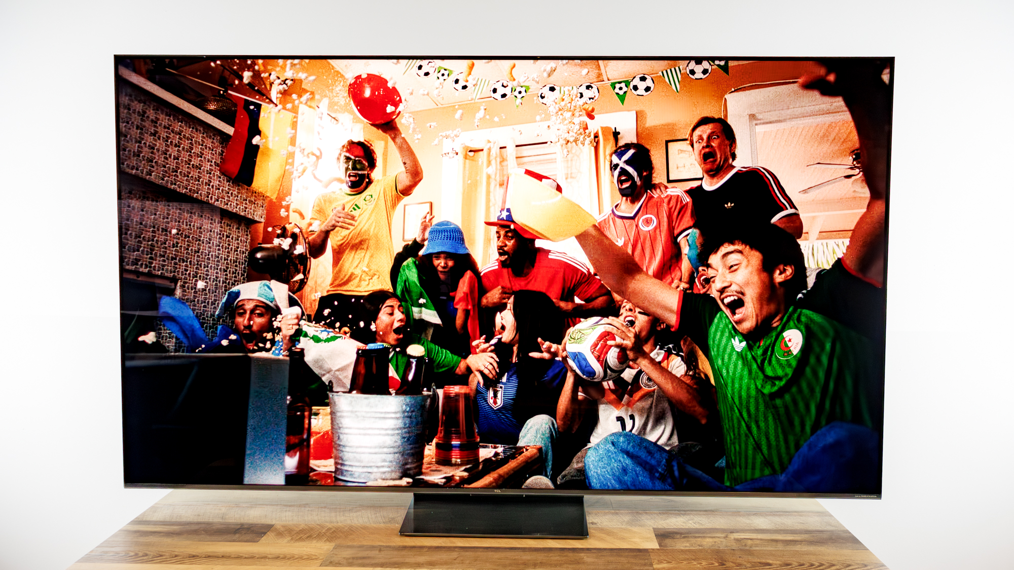 TCL QM7L 75-inch TV on a desk