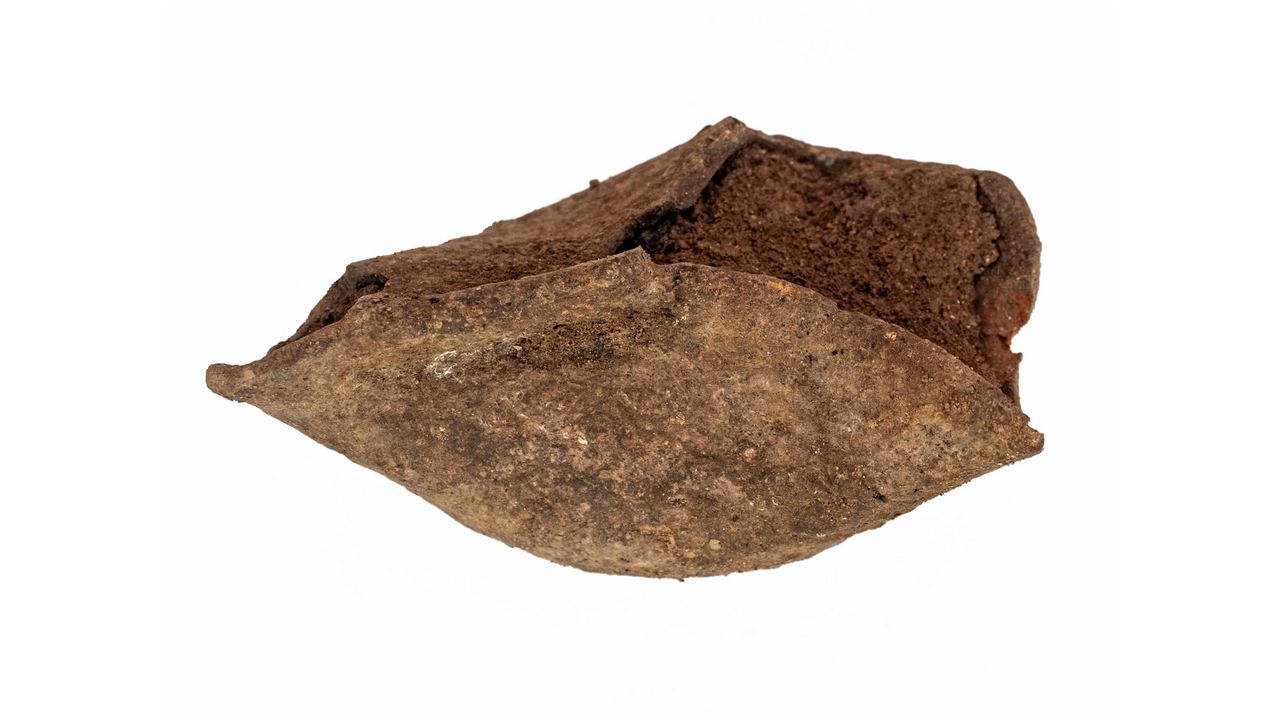 This image shows a close up of a roughly-shaped candle that archaeologists found in the ruins of an ancient farmstead in northern Israel. They believe that this artefact was from the Hasmonean period.