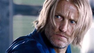 Haymitch Abernathy looks at something offscreen