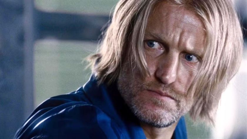 Haymitch Abernathy looks at something offscreen