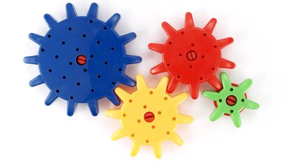 Plastic gears in primary colors and different sizes.