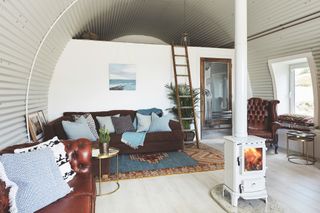 living room with round barrel vaulted ceiling and timber panelling