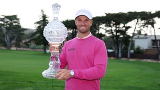 Wyndham Clark with the trophy after his win at the Pebble Beach Pro-Am