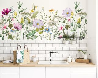 Modern country splashback with white metro tiles and meadow mural.