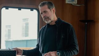 Kevin looks at something offscreen