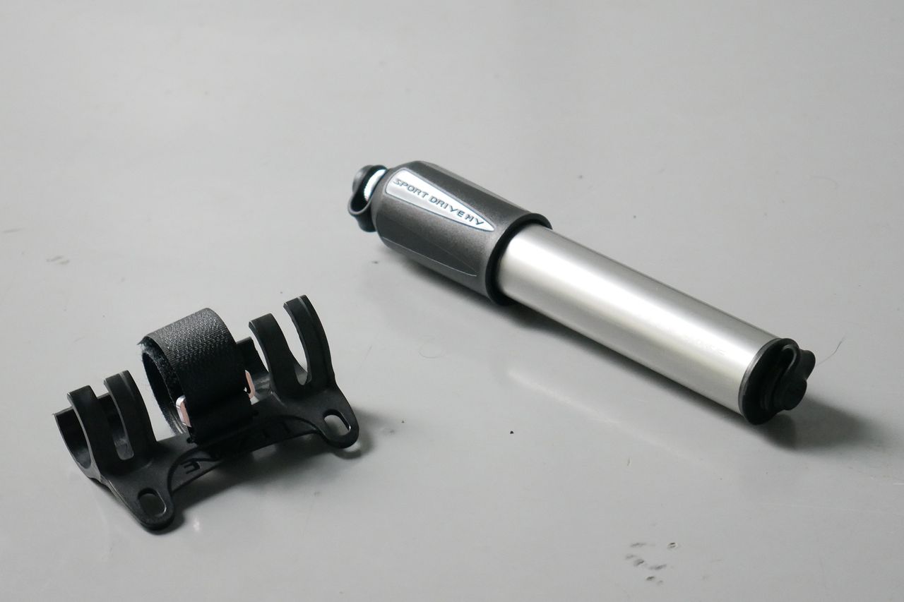 Best bike mini pumps group test 2026 - Lezyne Sport Drive sat next to its bottle cage mount