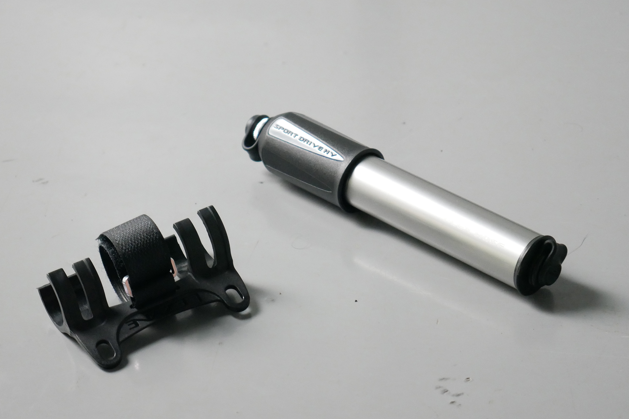Best bike mini pumps group test 2026 - Lezyne Sport Drive sat next to its bottle cage mount
