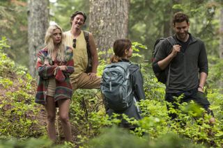 Oliver Jackson-Cohen (on right) as Will during a trek in the forest.