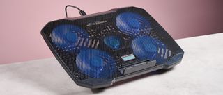 The Aimuzi F2 Plus laptop cooling pad at a 3/4s angle in front of a pink background..