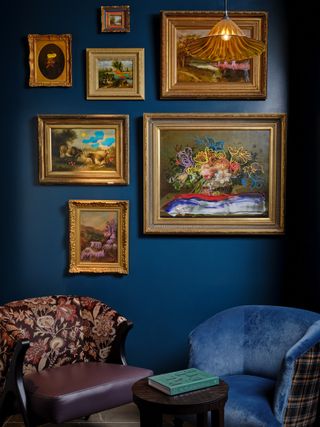 blue snug with gold framed artwork by Bergman Design House at The Other House