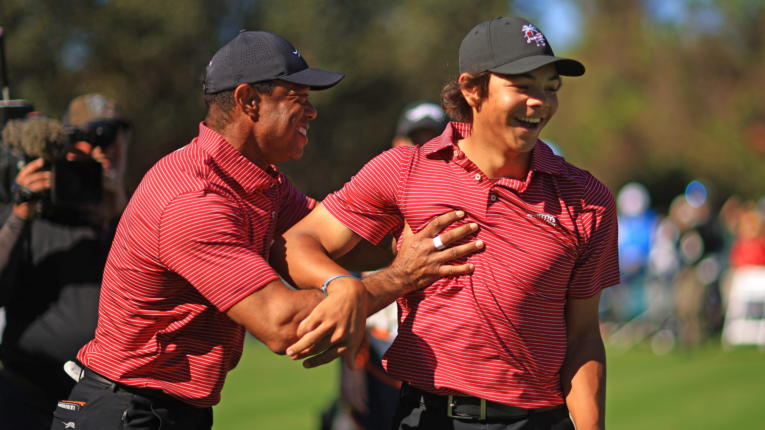 Tiger Woods and son Charlie celebrate his hole-in-one at the PNC Championship
