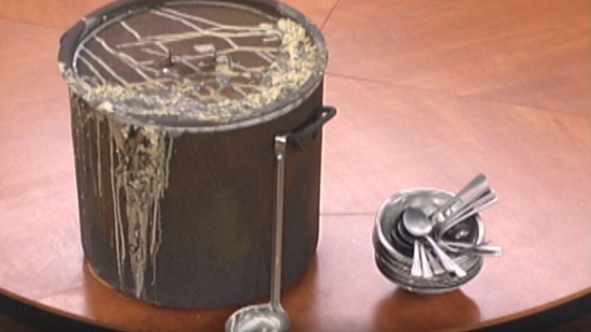 A closeup of a pot of slop on the table in Big Brother