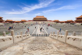 tourists visiting the forbidden city in beijing, china