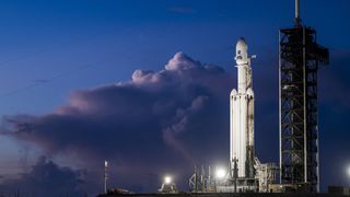 A SpaceX Falcon Heavy rocket carrying the Roman Space Telescope on the launch pad in Florida.