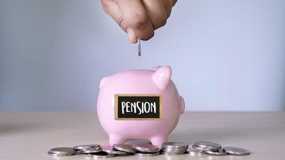 picture of man putting coins in a pension piggy bank