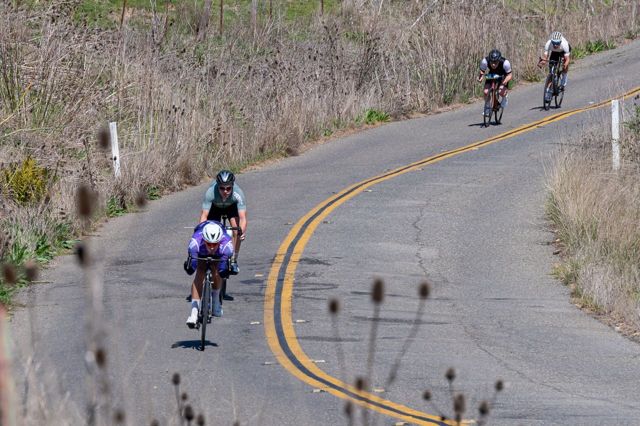 Riders head down a descent
