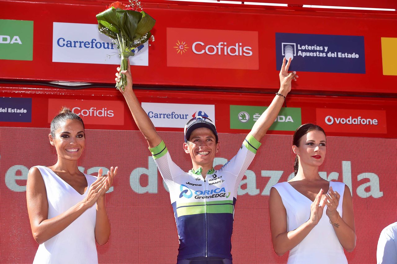 Estaban Chaves celebrates on the podium after stage 6.
