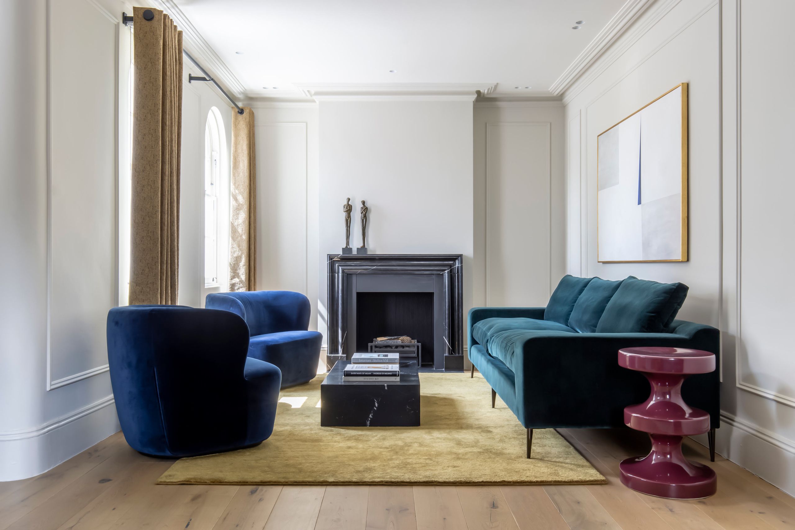 Living room with colorful velvet sofa