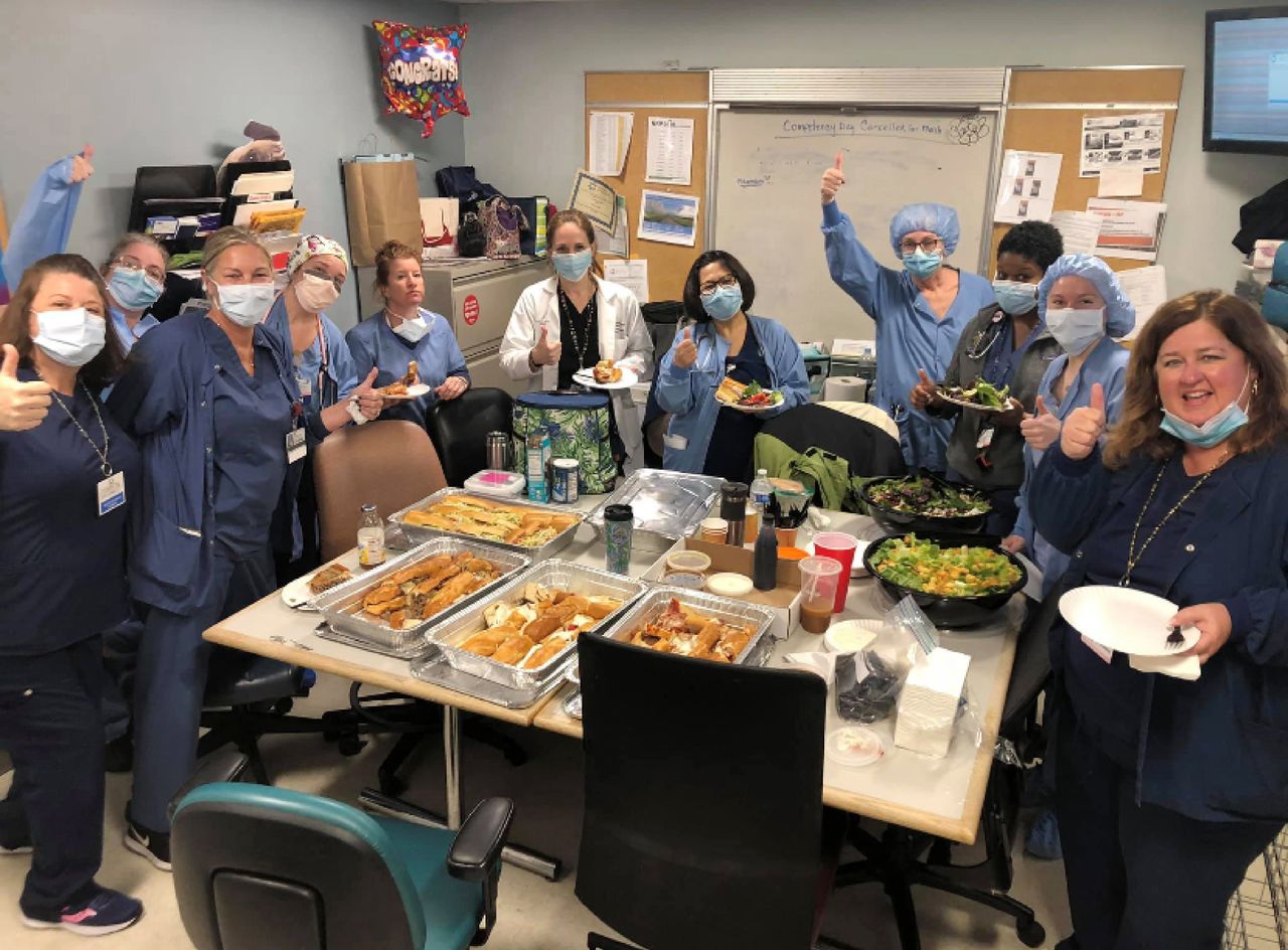 Health care workers with their pizza from Federico&amp;#039;s.