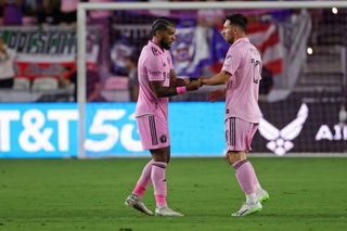 Lionel Messi #10 of Inter Miami CF receives the captain band from DeAndre Yedlin #2 after entering the match during the second half of the Leagues Cup 2023 match between Cruz Azul and Inter Miami CF at DRV PNK Stadium on July 21, 2023 in Fort Lauderdale