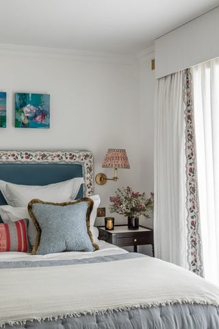 White bedroom with patterned headboard