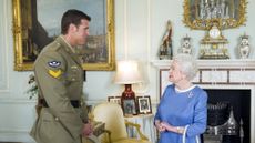 Britain's Queen Elizabeth (R) greets Australian Corporal Ben Roberts-Smith (L), who was recently honoured with the Victoria Cross, during an audience at Buckingham Palace in London on November 15, 2011. Roberts-Smith was awarded the VC, the highest military honour for an Australian, for gallantry during a tour of Afghanistan. AFP PHOTO / POOL / ANTHONY DEVLIN (Photo credit should read Anthony Devlin/AFP via Getty Images)