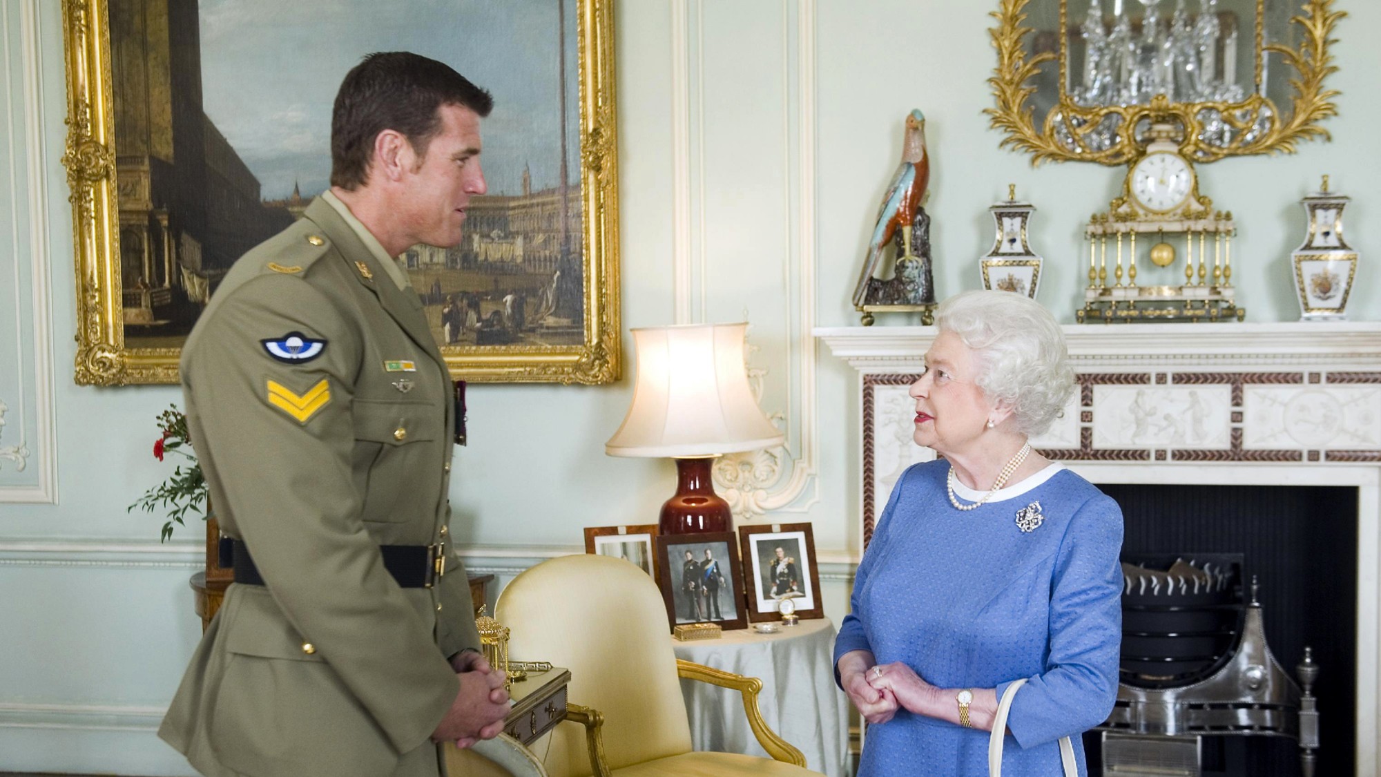 Britain's Queen Elizabeth (R) greets Australian Corporal Ben Roberts-Smith (L), who was recently honoured with the Victoria Cross, during an audience at Buckingham Palace in London on November 15, 2011. Roberts-Smith was awarded the VC, the highest military honour for an Australian, for gallantry during a tour of Afghanistan. AFP PHOTO / POOL / ANTHONY DEVLIN (Photo credit should read Anthony Devlin/AFP via Getty Images)