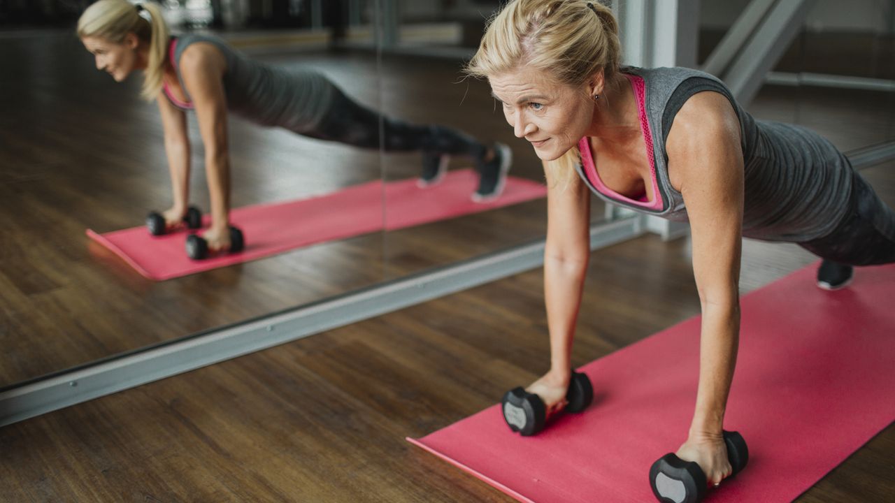 Woman using dumbbells to exercise