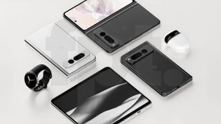 The Google Pixel Fold shown next a pair of Pixel Buds and a Pixel Watch. 