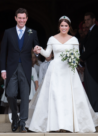 Princess Eugenie of York and Jack Brooksbank leave St George's Chapel in Windsor Castle following their wedding at St. George's Chapel on October 12, 2018 in Windsor, England