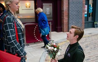 As Sinead Tinker [KATIE MCGLYNN] steps off the tram she’s floored to see the beautifully decorated garden. Daniel Osbourne [ROB MALLARD] drops to one knee and asks her to marry him.