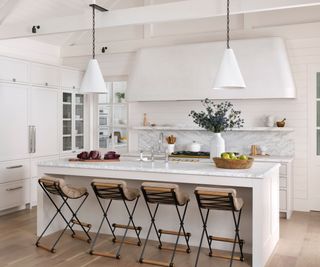 kitchen with white walls and cabinets and wooden floor