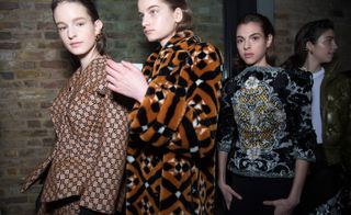Model wears a patterned teddy coat, whilst others wear patterned and embellished jackets