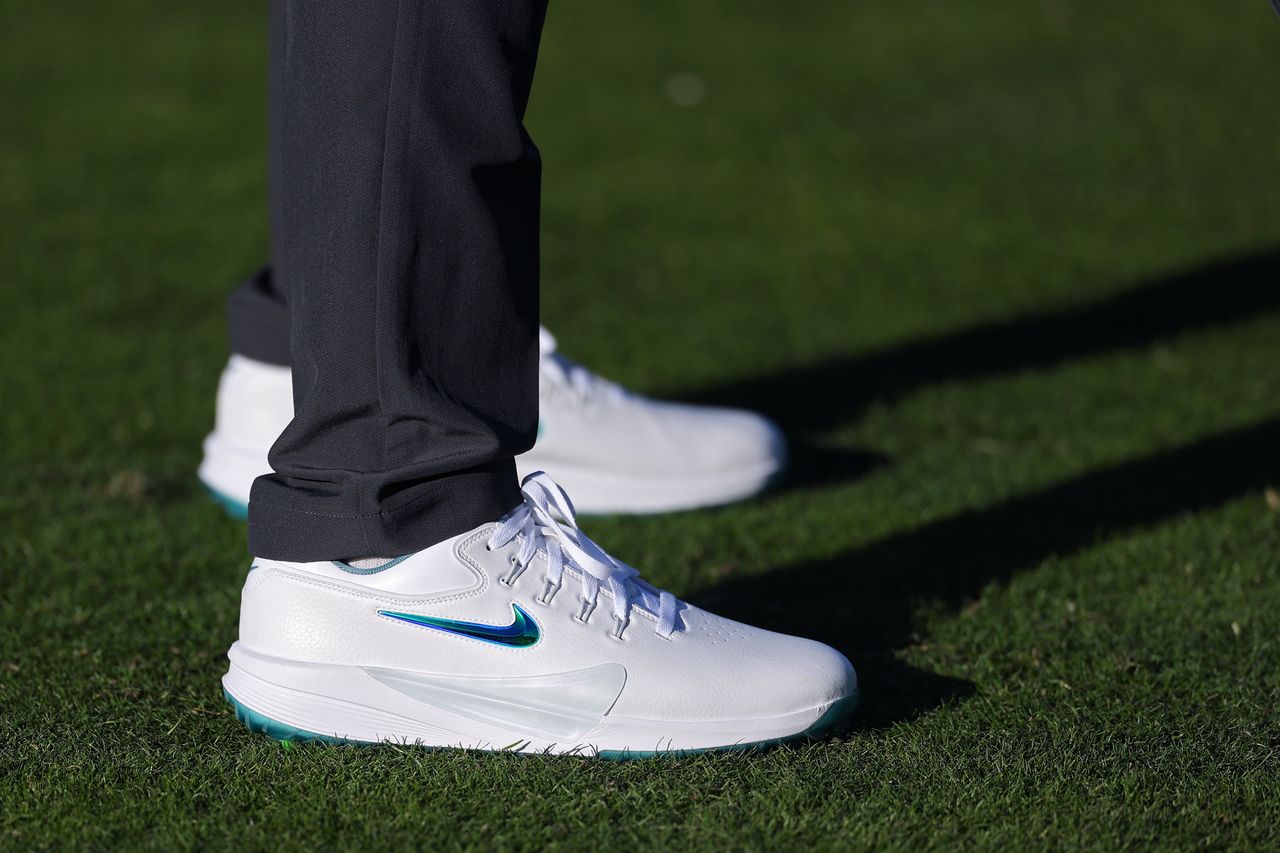 A close up of Scottie Scheffler's golf shoes