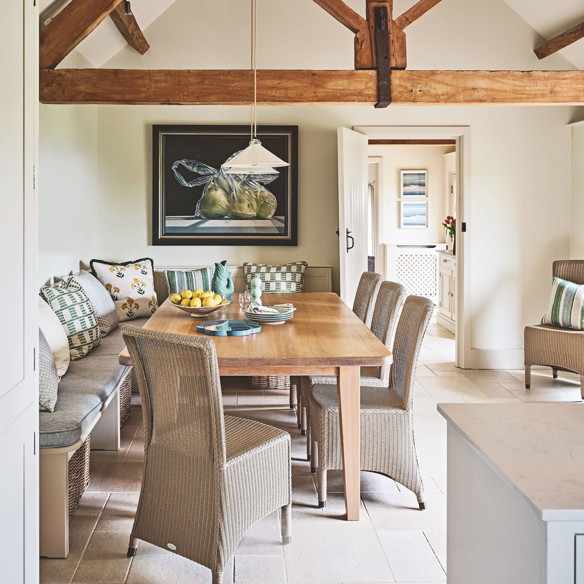 exterior of converted cowshed with patio with wicker patio furniture