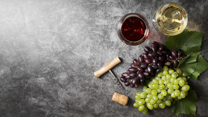 Red and white grapes, and wine.