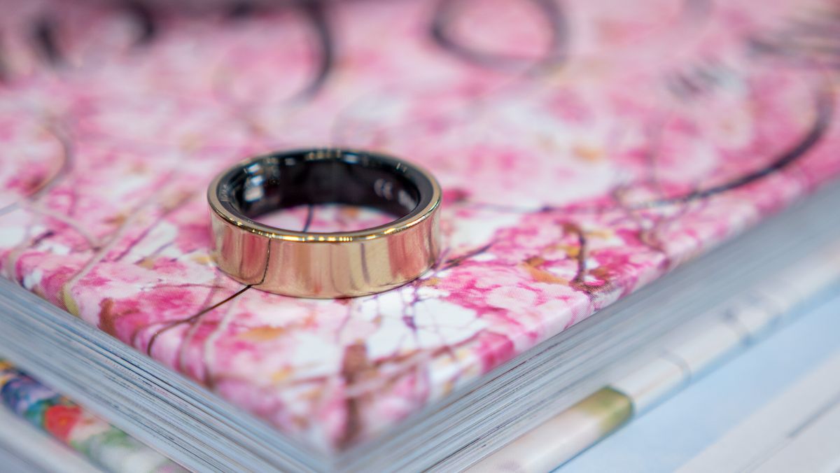 The Galaxy Ring on a book with a flowery design